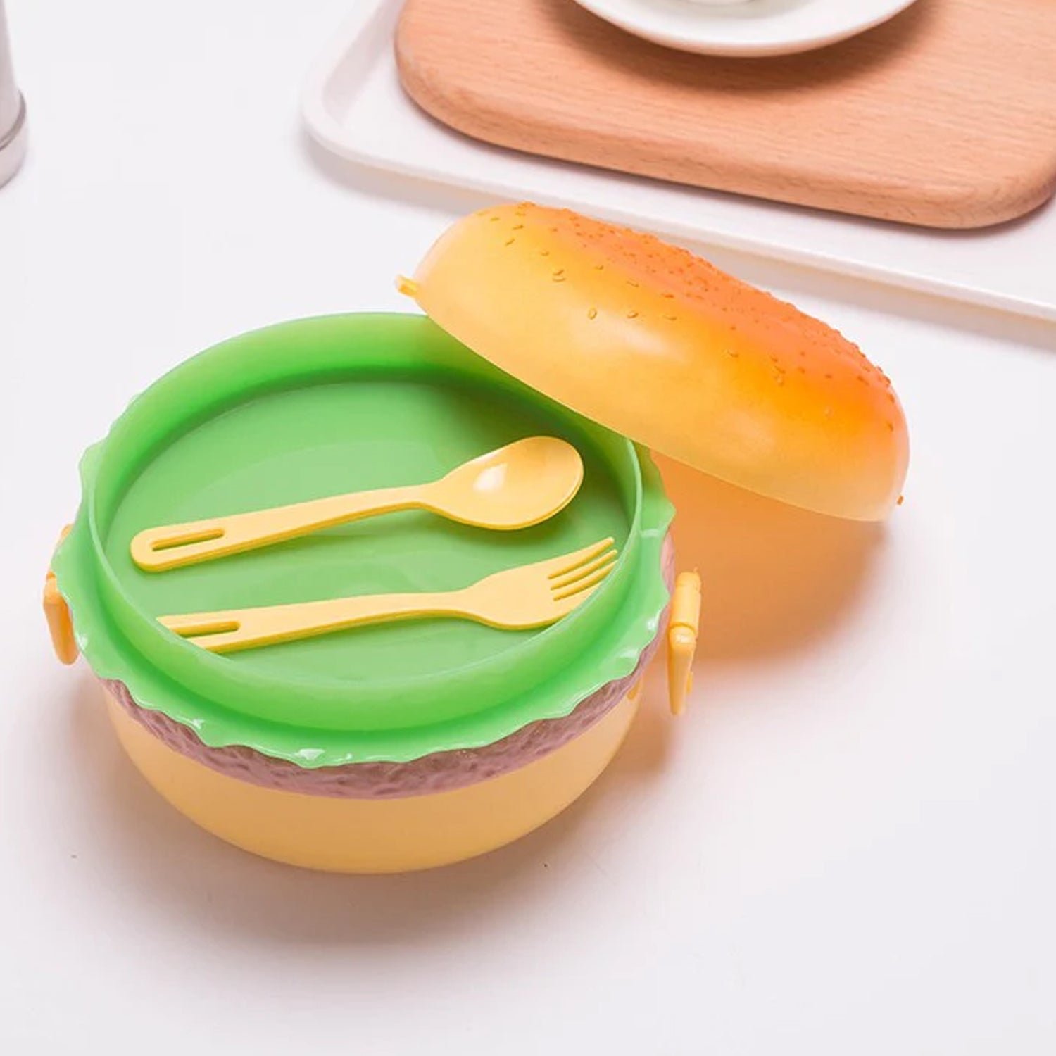 04_c0f065d0-3b97-42ac-91a1-3affdbe08b7e.jpg Burger Shape Lunch Box – Double Layer 1000ml Food Container with 2 Spoons for Kids - Image 1